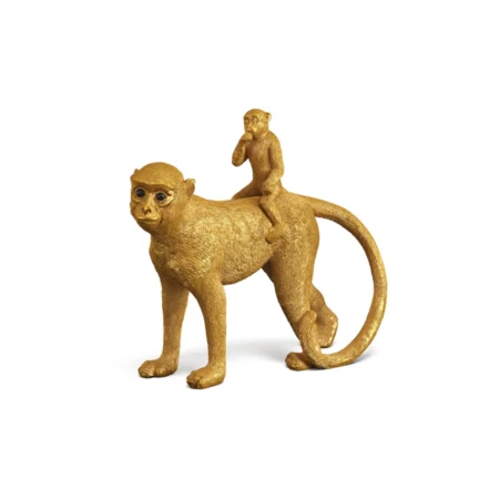 Gold monkey statue displayed in creative 3D rendering.