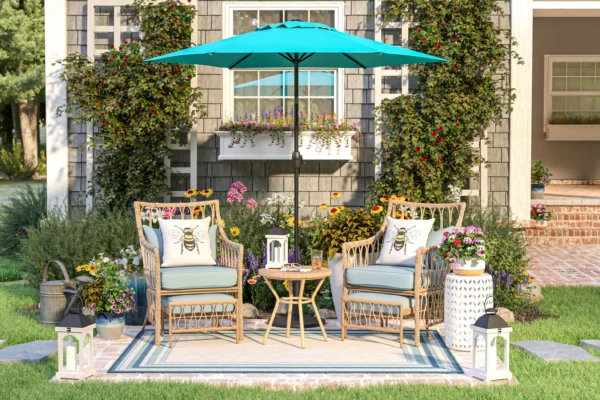 patio furniture 3D rendering featuring bee-themed pillows and a turquoise umbrella.