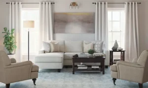 A product lifestyle shot of a living room with a cream sectional sofa, matching armchairs, and a wooden coffee table, designed for the home furnishing industry.