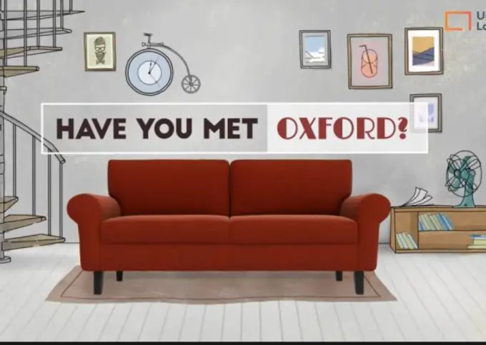 Red Oxford sofa in a modern living room setup.